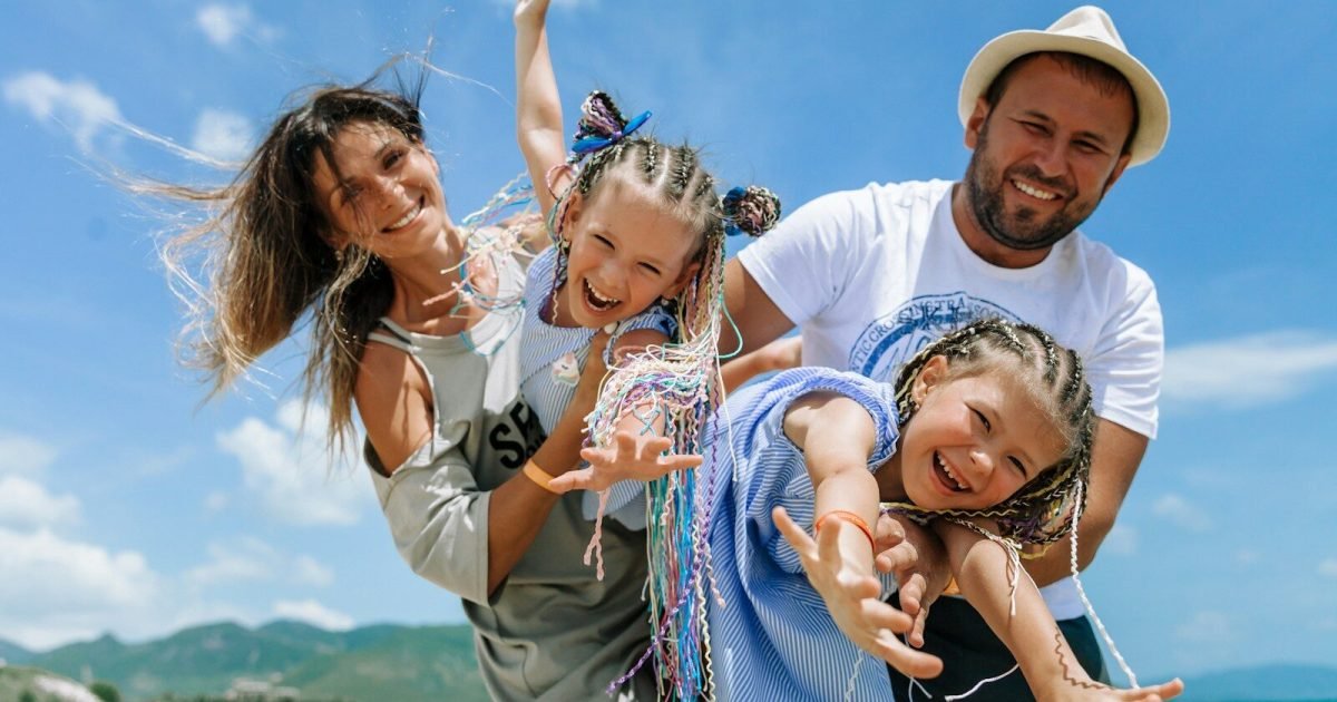 Happy family enjoying a sunny day in the city