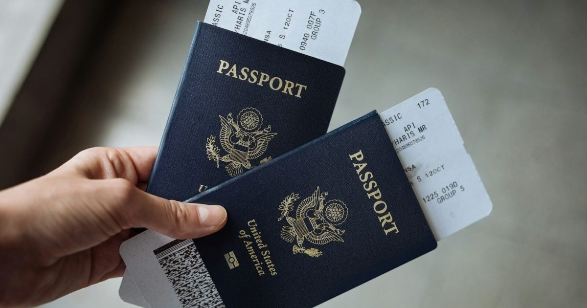 Parent holding two US passports before a family trip
